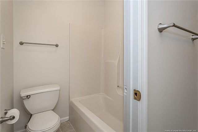 full bath featuring toilet and tile patterned floors