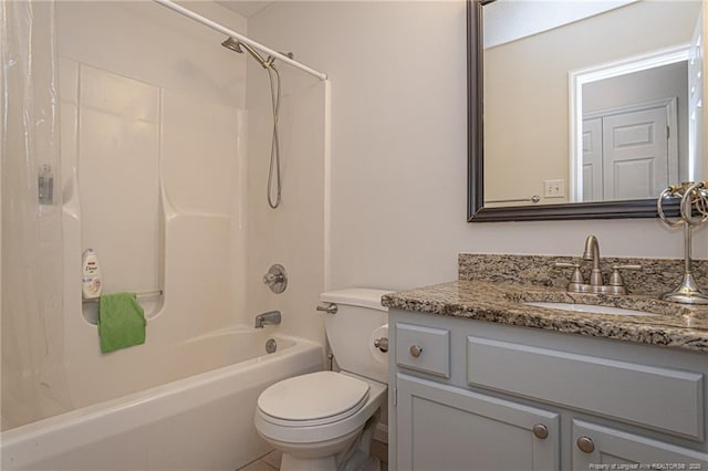 bathroom featuring vanity, shower / bathtub combination, and toilet