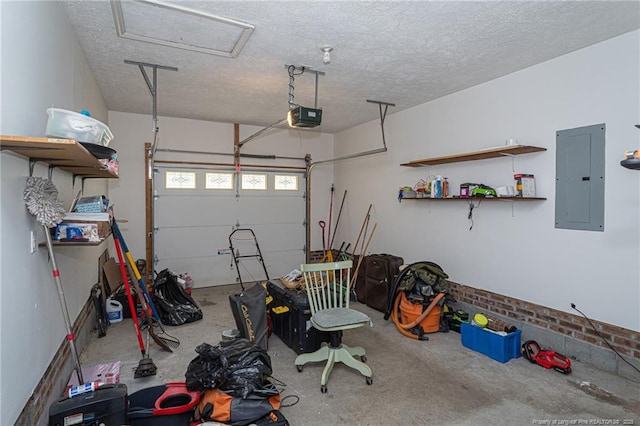 garage with a garage door opener and electric panel
