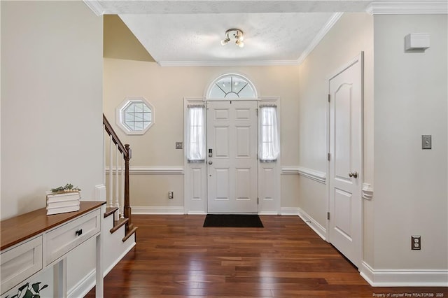 entryway with ornamental molding, stairs, baseboards, dark wood-type flooring, and a textured ceiling