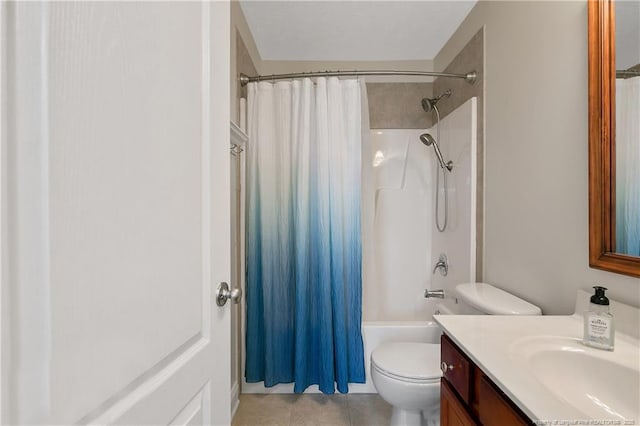 bathroom featuring vanity, tile patterned flooring, shower / bath combo, and toilet