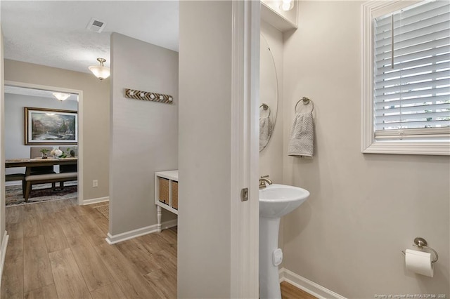 4631 Cedar Pass Dr, Hope Mills, NC 28348 - bathroom featuring baseboards, visible vents, and wood finished floors