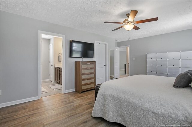 4631 Cedar Pass Dr, Hope Mills, NC 28348 - bedroom with baseboards, a textured ceiling, and wood finished floors