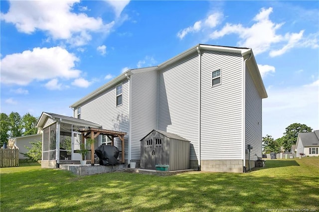 4631 Cedar Pass Dr, Hope Mills, NC 28348 - back of property featuring a storage shed, a yard, an outdoor structure, and a sunroom
