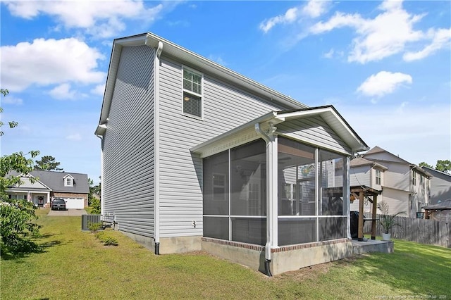 4631 Cedar Pass Dr, Hope Mills, NC 28348 - rear view of house with a sunroom, fence, and a yard