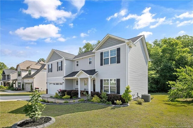 4631 Cedar Pass Dr, Hope Mills, NC 28348 - view of front of property featuring an attached garage, a front lawn, central air condition unit, and concrete driveway