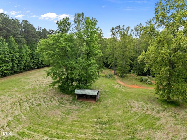 view of yard with a forest view
