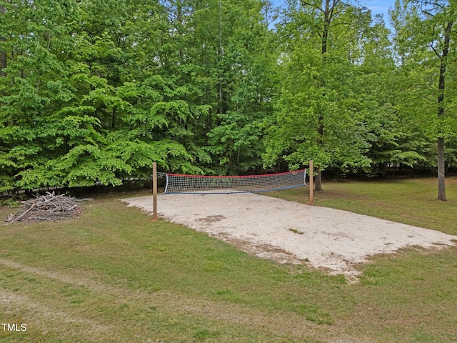surrounding community featuring volleyball court and a yard