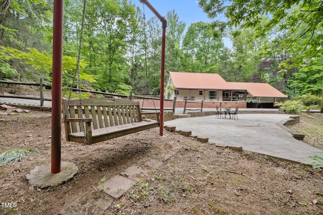 view of patio featuring fence
