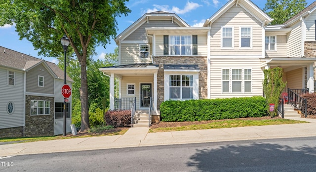 townhome / multi-family property with stone siding