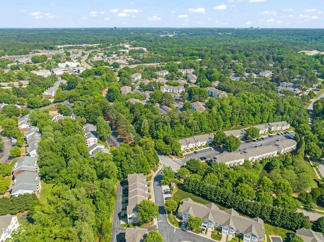 bird's eye view with a forest view and a residential view