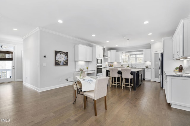 277 High Ridge Ln, Pittsboro, NC 27312 - dining space with recessed lighting, ornamental molding, dark wood finished floors, and baseboards