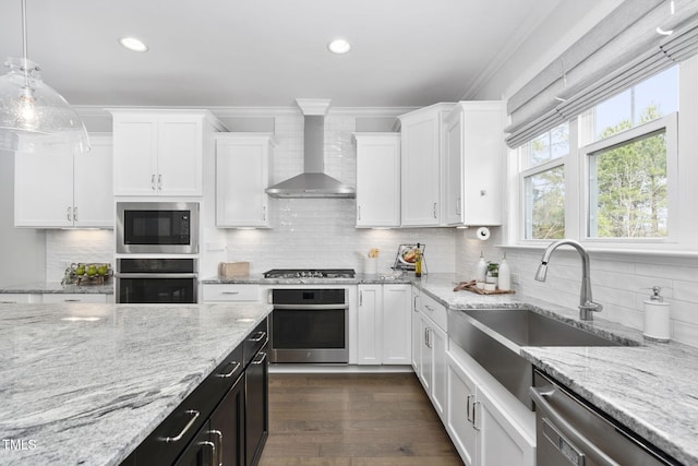 277 High Ridge Ln, Pittsboro, NC 27312 - kitchen with crown molding, white cabinetry, appliances with stainless steel finishes, and wall chimney exhaust hood