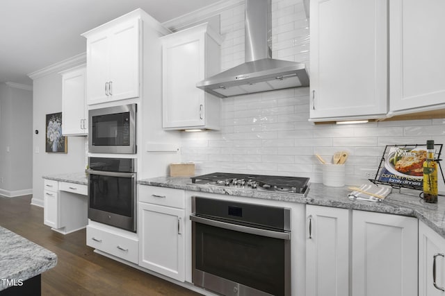 277 High Ridge Ln, Pittsboro, NC 27312 - kitchen featuring crown molding, wall chimney exhaust hood, white cabinets, tasteful backsplash, and appliances with stainless steel finishes
