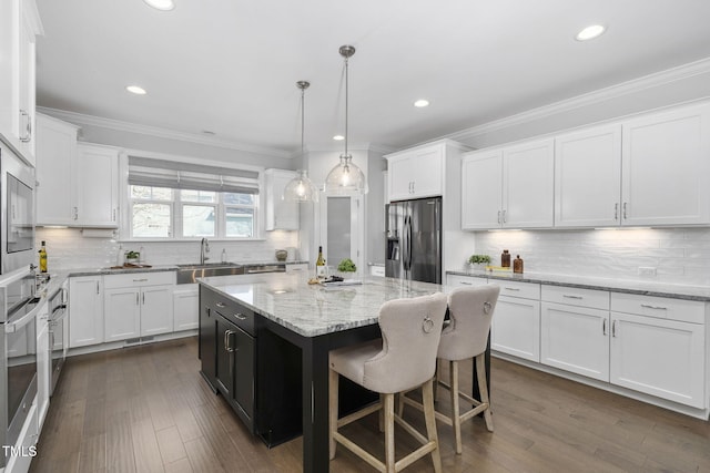 277 High Ridge Ln, Pittsboro, NC 27312 - kitchen featuring white cabinets, stainless steel appliances, a kitchen island, and a sink