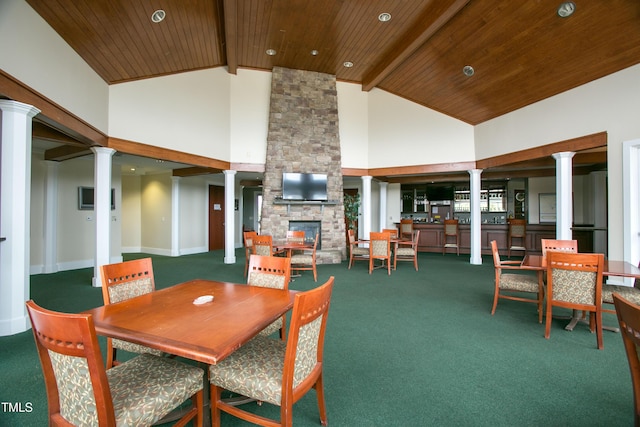 277 High Ridge Ln, Pittsboro, NC 27312 - dining space featuring wood ceiling, decorative columns, high vaulted ceiling, and carpet flooring