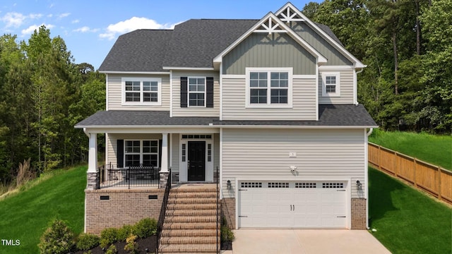 5 Cinnamon Teal Way, Youngsville, NC 27596 - craftsman house with an attached garage, concrete driveway, board and batten siding, covered porch, and a shingled roof
