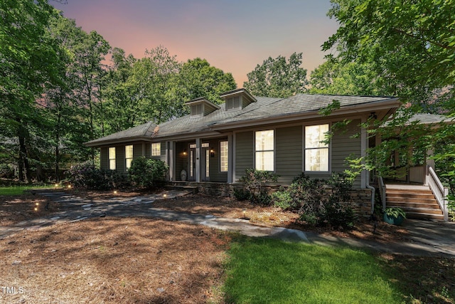 prairie-style house featuring covered porch