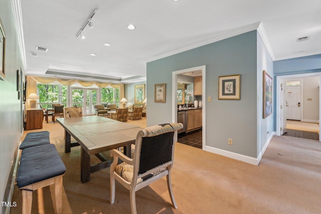 dining space with ornamental molding, carpet flooring, baseboards, track lighting, and recessed lighting