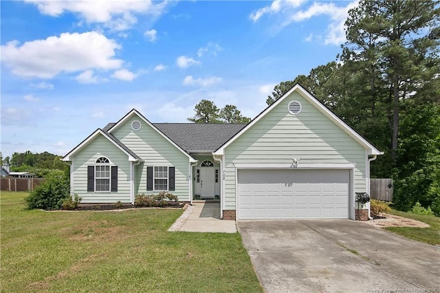 single story home with an attached garage, fence, driveway, and a front yard