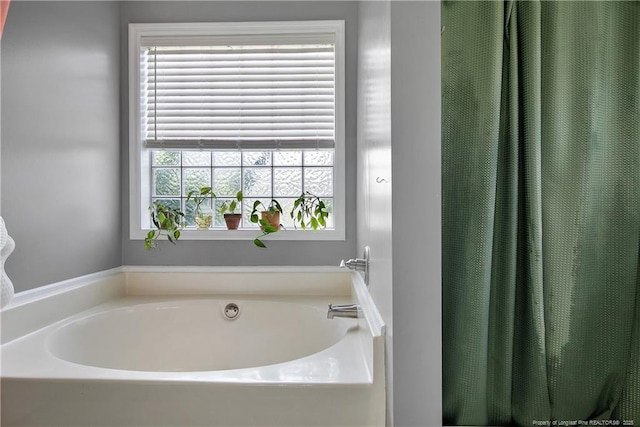 full bath with a bath