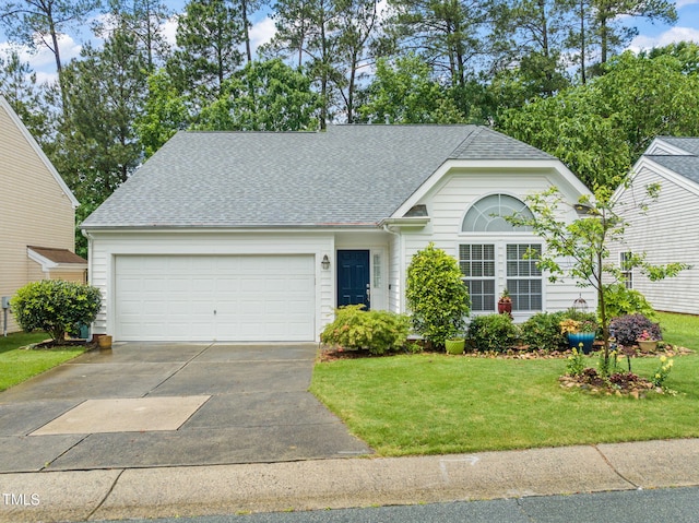 ranch-style home with concrete driveway, a shingled roof, a garage, and a front lawn