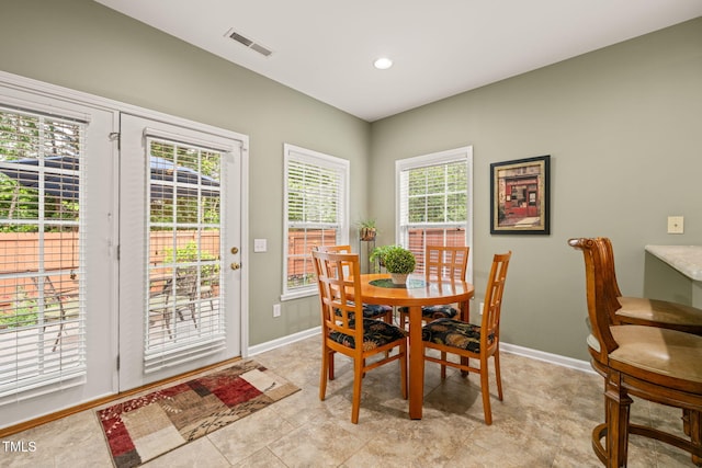 dining room featuring visible vents, baseboards, a healthy amount of sunlight, and recessed lighting