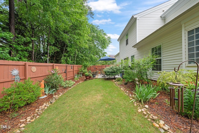view of yard with a fenced backyard
