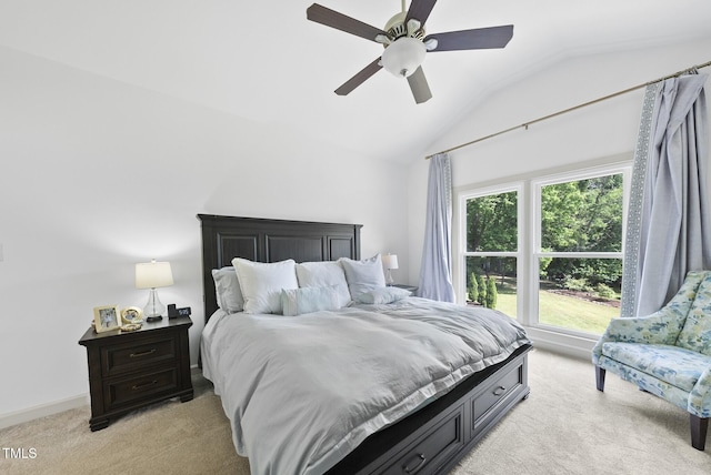 bedroom with baseboards, ceiling fan, lofted ceiling, and light colored carpet