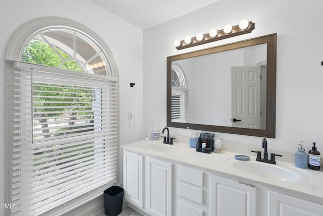 bathroom with double vanity and a sink