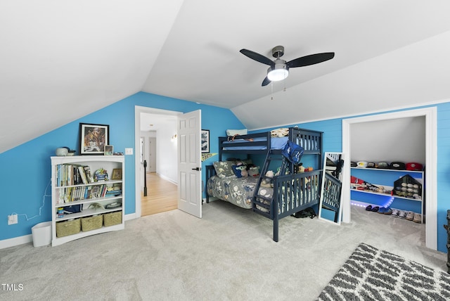 bedroom featuring carpet floors, a ceiling fan, and lofted ceiling