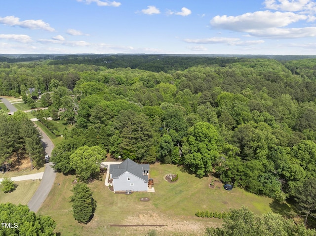 aerial view featuring a view of trees