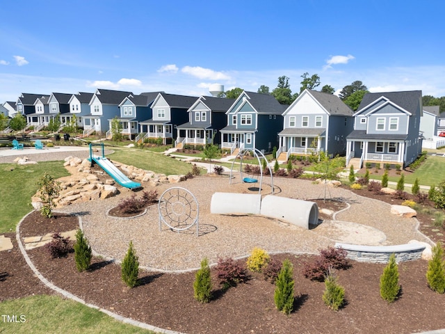 exterior space with a playground and a residential view