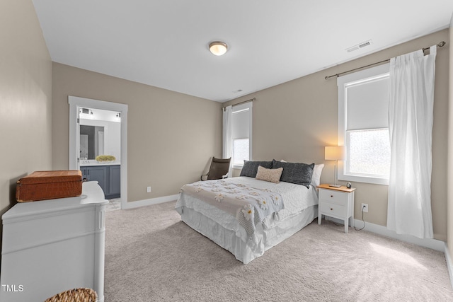 bedroom featuring baseboards, multiple windows, light carpet, and visible vents