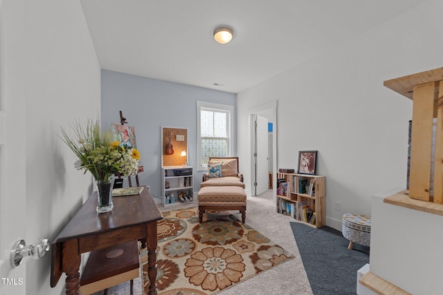 living area featuring carpet floors