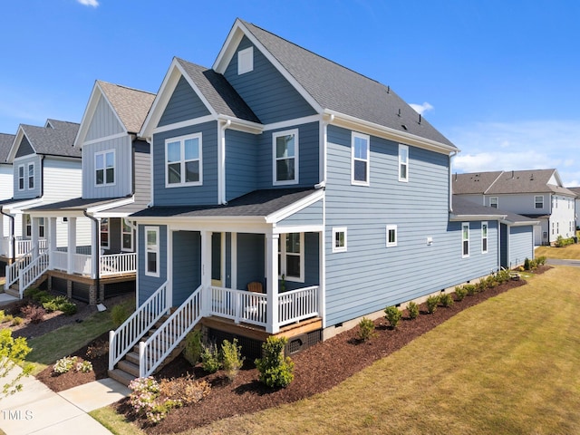 back of house featuring a porch, a shingled roof, a lawn, and crawl space