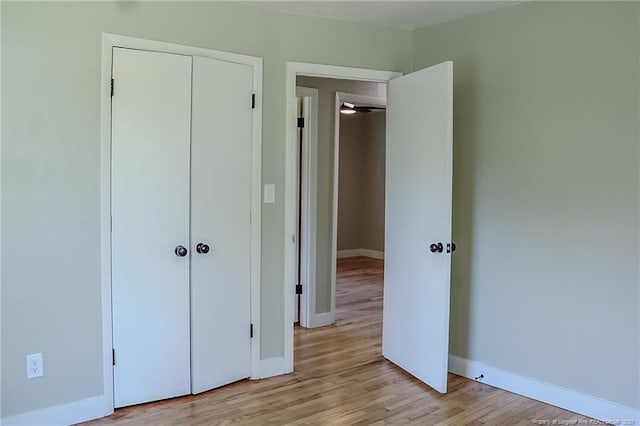 1825 Camelot Dr, Fayetteville, NC 28304 - unfurnished bedroom with light wood-style floors, baseboards, and a closet