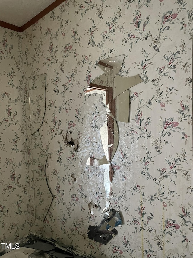 details with crown molding and wallpapered walls