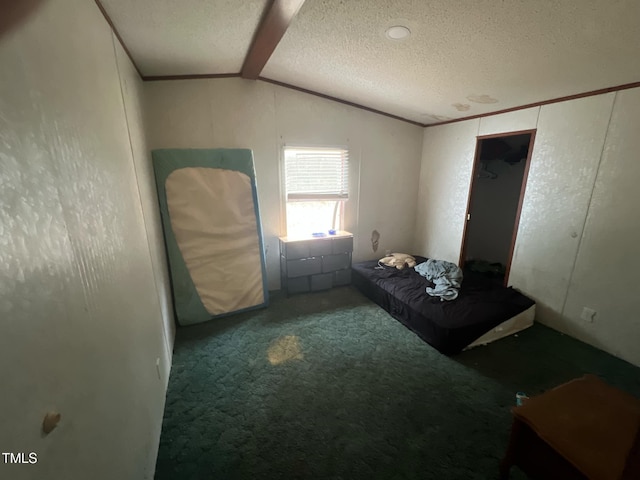 bedroom with carpet floors, ornamental molding, a textured ceiling, and lofted ceiling