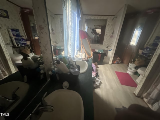 misc room featuring wallpapered walls