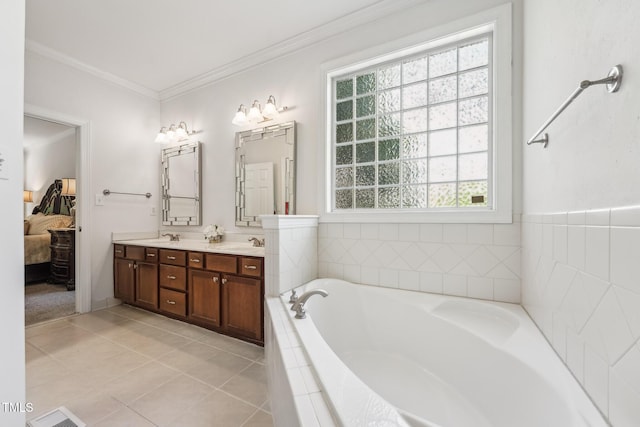ensuite bathroom featuring double vanity, a bath, tile patterned floors, and ornamental molding