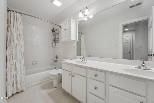 bathroom with shower / bath combo, double vanity, tile patterned floors, and toilet