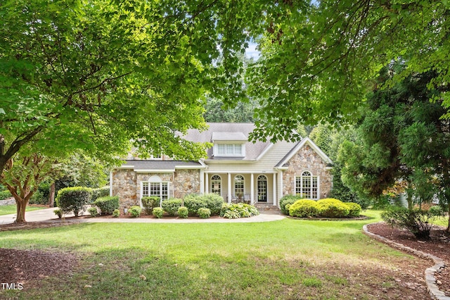 2709 Penfold Ln, Wake Forest, NC 27587 - view of front of property featuring stone siding, a porch, and a front yard