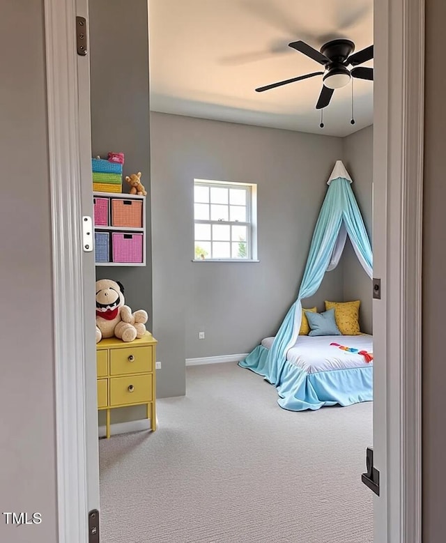 5029 Carole Dr, Wilson, NC 27893 - carpeted bedroom with ceiling fan and baseboards