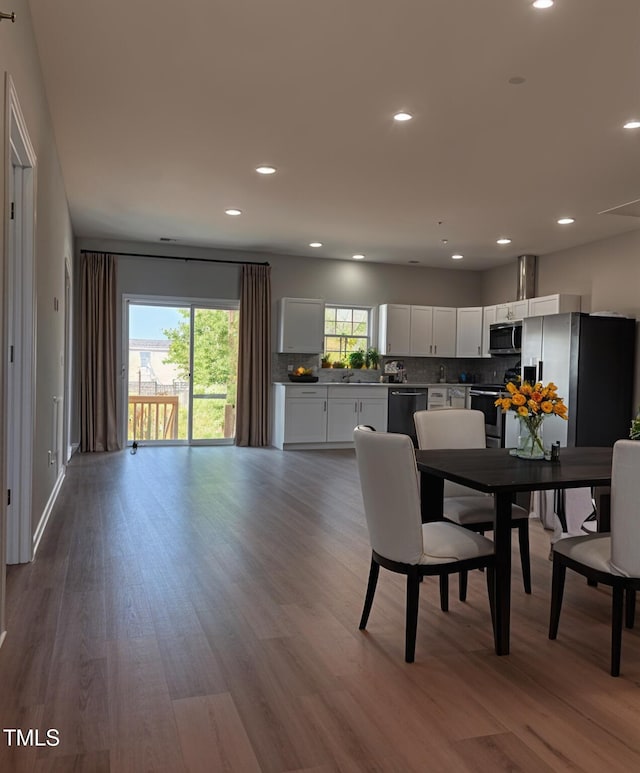 5029 Carole Dr, Wilson, NC 27893 - dining room with dark wood finished floors and recessed lighting