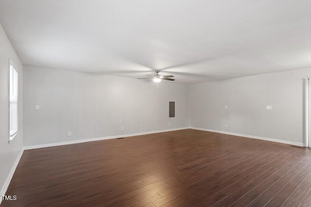 5613 Deerborn Dr, Apex, NC 27539 - empty room featuring ceiling fan, baseboards, and dark wood-type flooring