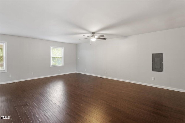 5613 Deerborn Dr, Apex, NC 27539 - spare room featuring electric panel, dark wood-style flooring, baseboards, and ceiling fan