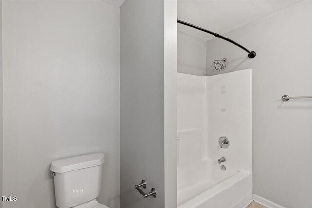 5613 Deerborn Dr, Apex, NC 27539 - bathroom featuring toilet and shower / bathtub combination