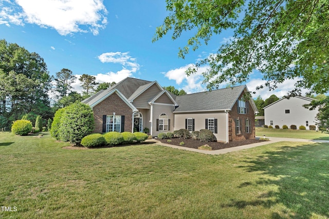 95 Live Oak Dr, Louisburg, NC 27549 - view of front of property with brick siding and a front yard