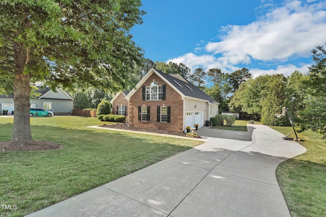 95 Live Oak Dr, Louisburg, NC 27549 - traditional-style home featuring brick siding, concrete driveway, a front lawn, and a garage